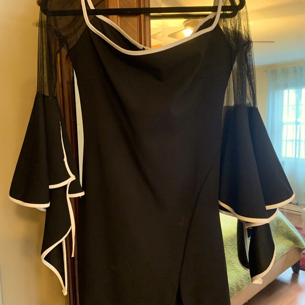 Off shoulder short black dress with a small slit on the side. Great shape